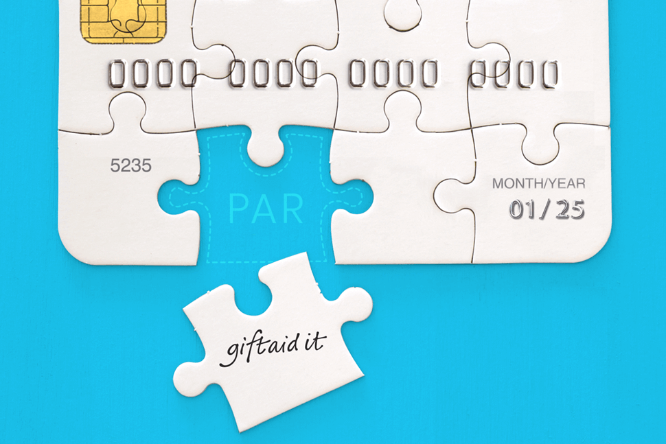 A jigsaw of a payment card with the last jigsaw piece (Gift Aid) that could be inserted into the hole (PAR) to complete the puzzle