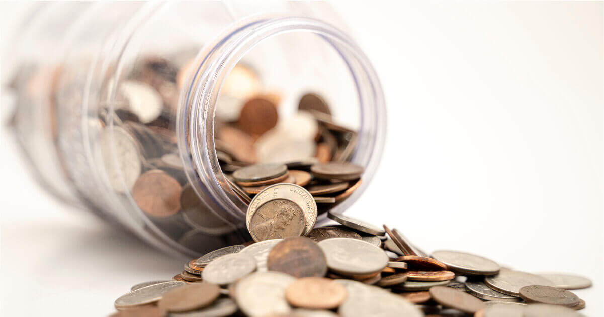 A fallen jar of spilled coins